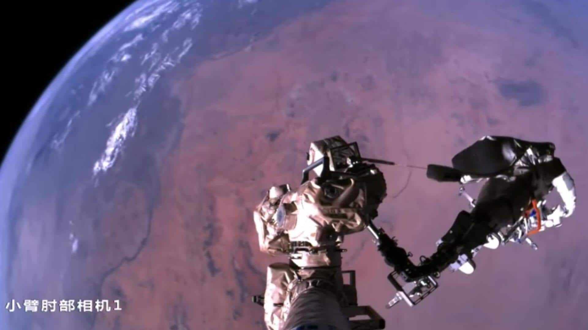 पृथ्वी के ऊपर लटका दिखा अंतरिक्ष यात्री, चीनी अंतरिक्ष एजेंसी ने शेयर किया वीडियो