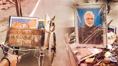 Sanitation worker sacked after Modi, Yogi's photos found in trash Sanitation worker sacked after Modi, Yogi's photos found in trash