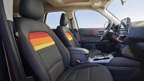 The SUV flaunts bright-colored decals inspired by the sunset