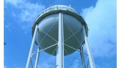 Man booked in extortion case climbs water tank, threatens self-immolation Man booked in extortion case climbs water tank, threatens self-immolation