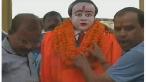BJP MLA wraps Ambedkar statue with saffron-clothes after pouring milk BJP MLA wraps Ambedkar statue with saffron-clothes after pouring milk