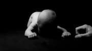 Newborn's body with paper stuffed in mouth found on flight