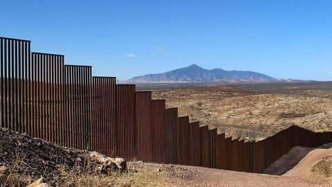 Trump says border wall to have "openings," scales back length Trump says border wall to have "openings," scales back length