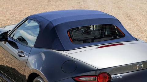 The car features a neatly-folding fabric roof