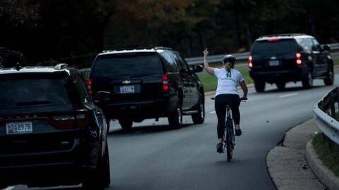 Employers fire cyclist who showed middle-finger to Trump's motorcade Employers fire cyclist who showed middle-finger to Trump's motorcade