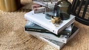 Stacked books can magically transform your side table 