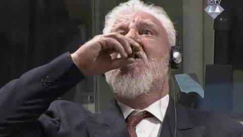 Bosnian Croat war criminal drinks poison in UN courtroom, dies Bosnian Croat war criminal drinks poison in UN courtroom, dies