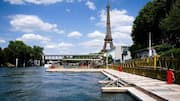 Man arrested after climbing Eiffel Tower to hang US flag