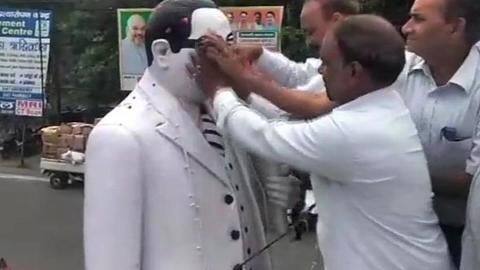 UP: After BJP-minister garlands Ambedkar-statue, Dalit-lawyers 'purify' it with gangajal UP: After BJP-minister garlands Ambedkar-statue, Dalit-lawyers 'purify' it with gangajal