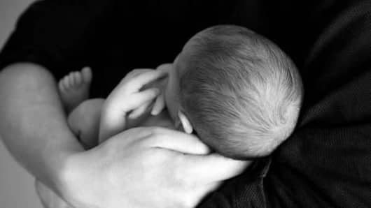 After husband's death, child born to woman
