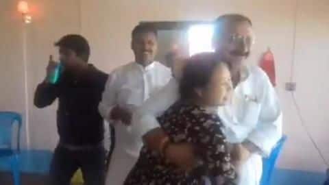 Caught-on-camera: RJD minister, on 'study tour', forcibly dances with woman Caught-on-camera: RJD minister, on 'study tour', forcibly dances with woman