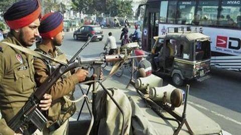 Security personnel are on their toes, keeping a strict eye Security personnel are on their toes, keeping a strict eye