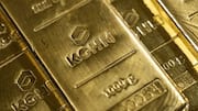 Gold edges higher as oil price drop calms inflation worries