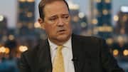 Cisco chairman and CEO Chuck Robbins says slowing AI unrealistic