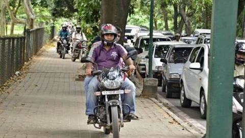 Bengaluru: It's either emptying pockets or jail-term for footpath riders Bengaluru: It's either emptying pockets or jail-term for footpath riders