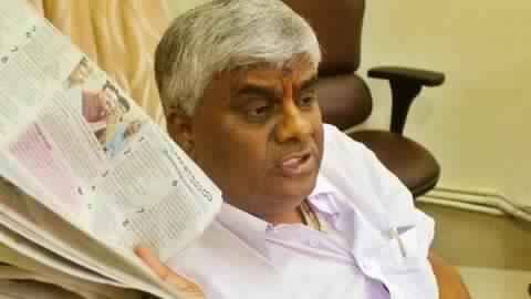 Karnataka Minister creates controversy by throwing biscuits at flood-hit victims Karnataka Minister creates controversy by throwing biscuits at flood-hit victims