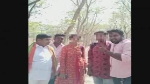 After forcefully marrying them, activist shakes hands with couple After forcefully marrying them, activist shakes hands with couple