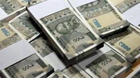BJP complains to EC about TMC candidate 'distributing cash' BJP complains to EC about TMC candidate 'distributing cash'