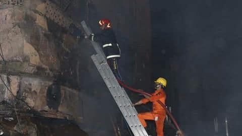 Firefighters using long hose pipes to set off the blaze Firefighters using long hose pipes to set off the blaze