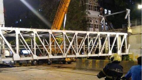 Entire frame of iron, steel brought down by cranes, gas-cutter Entire frame of iron, steel brought down by cranes, gas-cutter