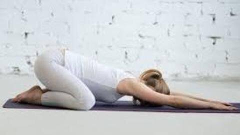 The Child's pose helps stretch your back and hips The Child's pose helps stretch your back and hips