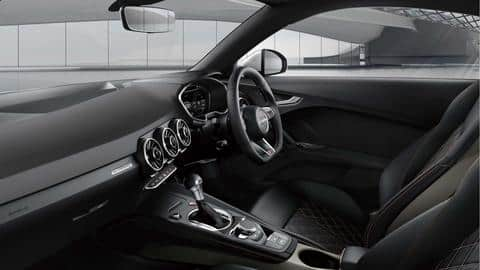 It features Nappa leather upholstery with contrasting bronze-colored stitching