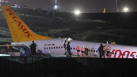 Turkish plane breaks apart after skidding off runway; 3 dead Turkish plane breaks apart after skidding off runway; 3 dead