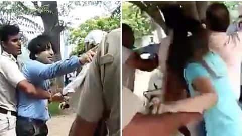 Couple jumps red-light, tries fleeing, almost runs over traffic constable Couple jumps red-light, tries fleeing, almost runs over traffic constable