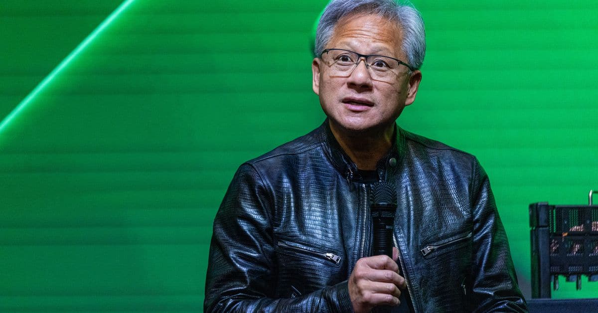 NVIDIA CEO Jensen Huang signs woman's chest at tech event