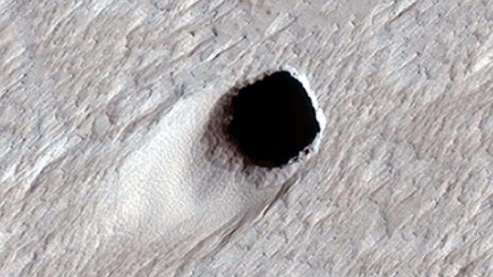 Enigmatic holes on Mars might hold secrets to extraterrestrial life