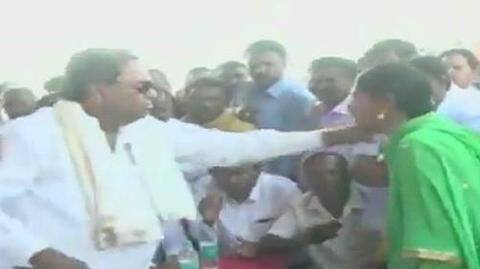 Congress leader Siddaramaiah misbehaves with woman; pulls dupatta Congress leader Siddaramaiah misbehaves with woman; pulls dupatta
