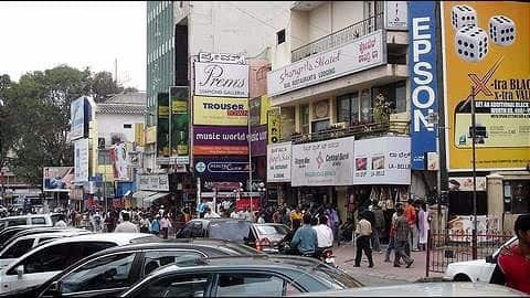Bengaluru: New malls threateningly tower over old shops in Majestic Bengaluru: New malls threateningly tower over old shops in Majestic
