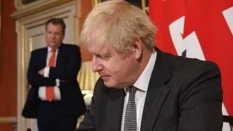 UK PM signs 'historic' Brexit deal after vote in Parliament UK PM signs 'historic' Brexit deal after vote in Parliament