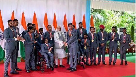 PM Modi hosts Indian Paralympic contingent, presented with autographed stole PM Modi hosts Indian Paralympic contingent, presented with autographed stole
