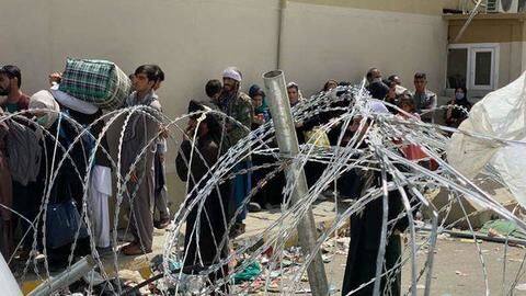 Afghanistan: Women throw babies over fence to 'safety' fearing Taliban Afghanistan: Women throw babies over fence to 'safety' fearing Taliban