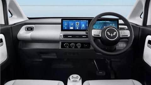 It has a minimalist dashboard design with soft-touch materials
