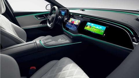 It features three screens and a dashboard-mounted selfie camera