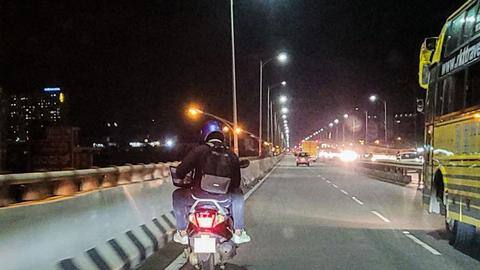 Bengaluru: Man spotted working on laptop while riding a bike Bengaluru: Man spotted working on laptop while riding a bike