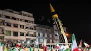 Iran holds rallies featuring ballistic missile launcher 