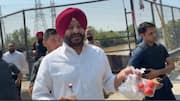 BJP leader detained for waving liquor bottle at Bhagwant Mann
