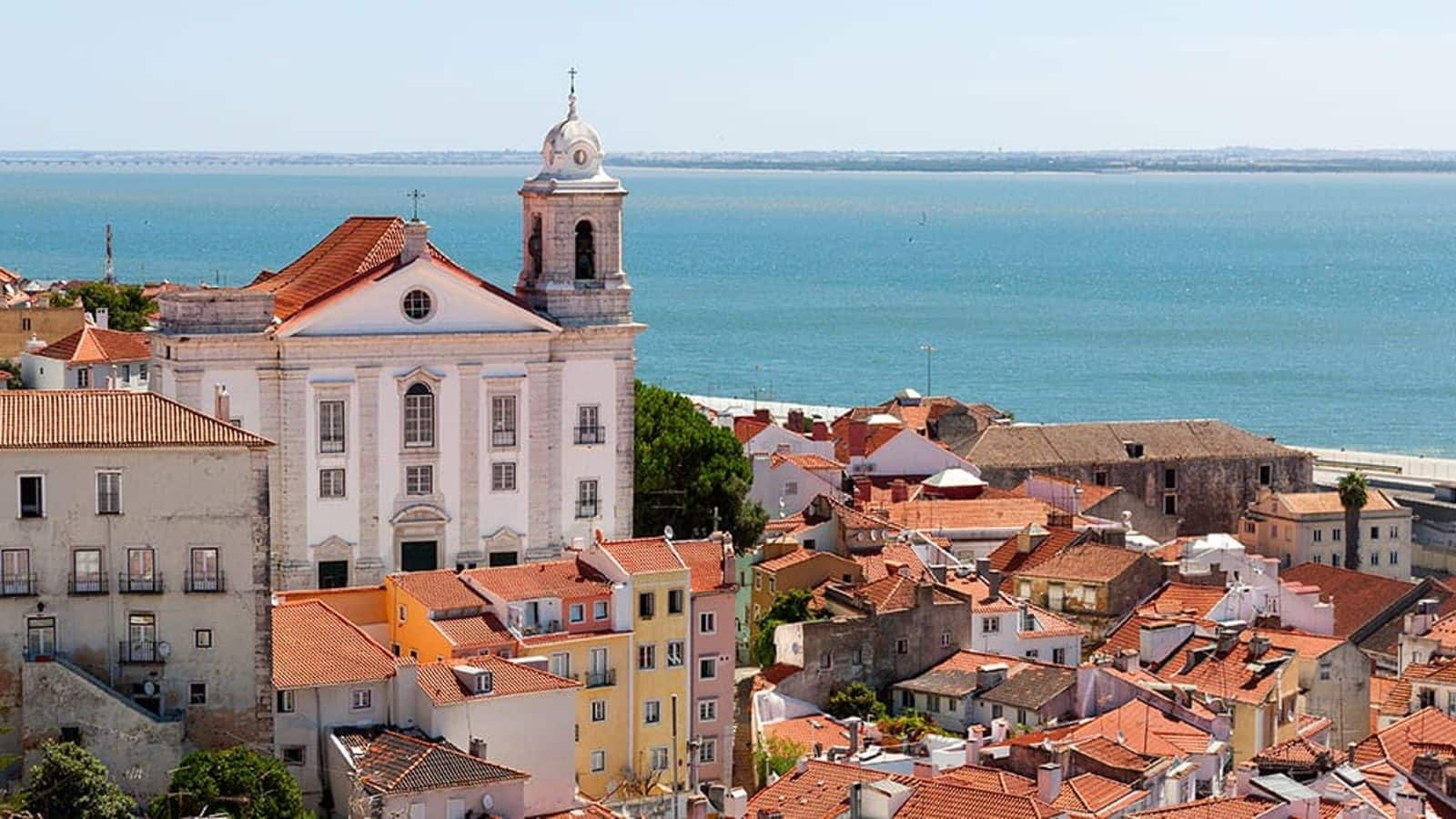 Visit Alfama's artisan alleys that brim with historic allure