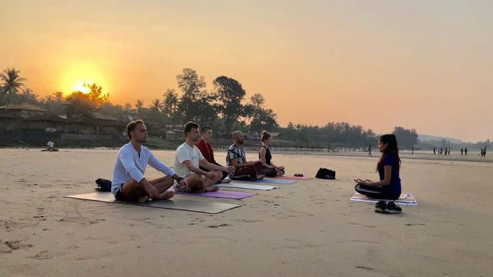 Head over to Mumbai's tranquil beach yoga escapes
