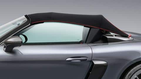 The car features a removable and manually-operated fabric roof