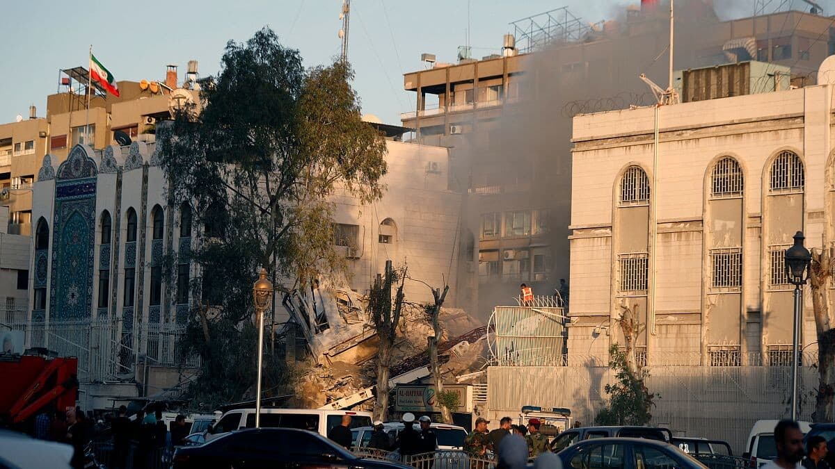 Syrian rebels storm Iranian embassy, rip banner of Assad's allies  