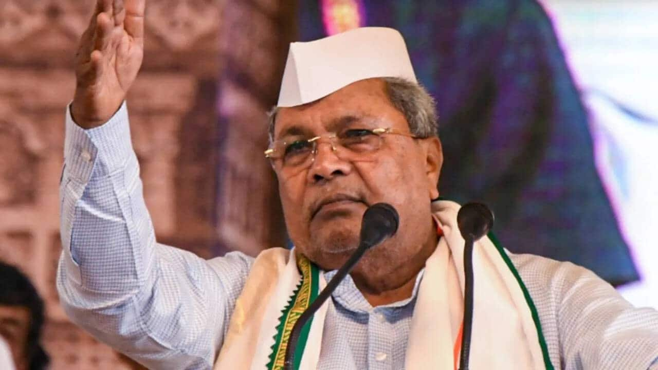 Video: Security breach at Siddaramaiah's event, man climbs on stage