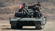 Kim Jong-Un oversees drill showcasing new tank with his daughter