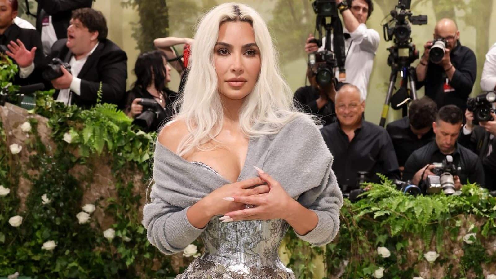 Met Gala: Kim Kardashian matches metallic corset with comfortable cardigan