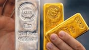 Gold, silver prices steady as oil spikes and dollar strengthens