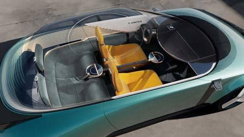 It features a round coffee table on the center console