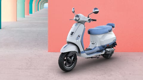 The scooter features a neo-retro design with dual-tone color schemes